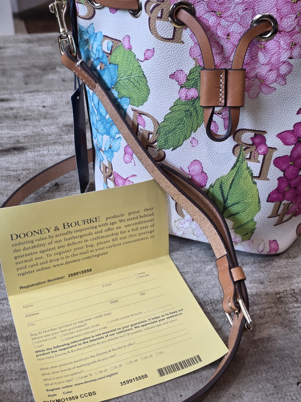 Dooney & Bourke White Floral Drawstring Bucket Bag